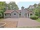 The backyard features a large deck, patio, an outdoor fireplace with a fire pit at 85 Holly Springs Rd, Sharpsburg, GA 30277