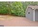 The backyard features a deck with a fire pit, and siding on the home's exterior at 85 Holly Springs Rd, Sharpsburg, GA 30277