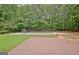 Inviting backyard features a private pool, deck and fire pit perfect for outdoor entertaining and relaxation at 85 Holly Springs Rd, Sharpsburg, GA 30277