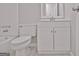 Bright bathroom includes a toilet, vanity with a white countertop, and bathtub with shower at 85 Holly Springs Rd, Sharpsburg, GA 30277