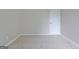 Neutral-toned bedroom with plush carpeting and a door leading to the rest of the home at 85 Holly Springs Rd, Sharpsburg, GA 30277