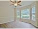 Charming breakfast nook with a bay window, offering natural light and a view of the outdoors at 85 Holly Springs Rd, Sharpsburg, GA 30277