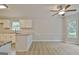 Eat-in kitchen area featuring light cabinets, granite countertops, stainless steel appliances, and tiled backsplash at 85 Holly Springs Rd, Sharpsburg, GA 30277