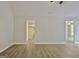 Living Room with hardwood floors and a doorway to what seems to be a closet; a ceiling fan is visible at 85 Holly Springs Rd, Sharpsburg, GA 30277