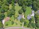 Aerial view of beautiful homes surrounded by lush trees and expansive green lawns at 1120 Rawlings Dr, Rutledge, GA 30663