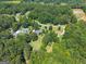 Bird's eye view showcasing properties nestled among lush greenery and tree coverage at 1120 Rawlings Dr, Rutledge, GA 30663