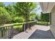 Spacious wooden deck overlooking a well-maintained backyard with mature trees at 1120 Rawlings Dr, Rutledge, GA 30663