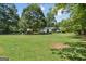 Expansive backyard with mature trees, offering a serene and private outdoor space at 1120 Rawlings Dr, Rutledge, GA 30663