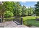 Large backyard with deck, lush lawn, shed and mature trees at 1120 Rawlings Dr, Rutledge, GA 30663