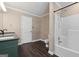 Bathroom featuring a double sink vanity, tile flooring, and a shower and tub combination at 1120 Rawlings Dr, Rutledge, GA 30663