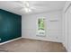 Bedroom featuring neutral walls, accent wall, window and closet at 1120 Rawlings Dr, Rutledge, GA 30663