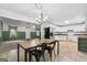 Spacious dining area flowing into the kitchen, with stylish lighting and a functional layout at 1120 Rawlings Dr, Rutledge, GA 30663