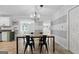 Cozy dining area with tile flooring, stylish chandelier, and easy access to the kitchen at 1120 Rawlings Dr, Rutledge, GA 30663