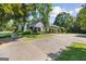Charming home featuring a well-maintained lawn, mature trees and a spacious driveway at 1120 Rawlings Dr, Rutledge, GA 30663