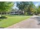 A charming home with a classic front porch and lush, green lawn at 1120 Rawlings Dr, Rutledge, GA 30663