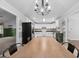Bright kitchen with white cabinets, stainless appliances, a breakfast area, and hardwood floors at 1120 Rawlings Dr, Rutledge, GA 30663
