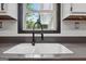Close-up of the kitchen sink featuring a modern faucet and subway tile backsplash at 1120 Rawlings Dr, Rutledge, GA 30663