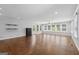 Bright living room features hardwood floors, a ceiling fan, recessed lighting, and many windows at 1120 Rawlings Dr, Rutledge, GA 30663