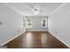 Bright living room with hardwood floors, three windows, ceiling fan and baseboard trim at 1120 Rawlings Dr, Rutledge, GA 30663