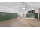 Spacious living room with neutral carpet, wainscoting and ample natural light at 1120 Rawlings Dr, Rutledge, GA 30663