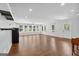 Bright living room features hardwood floors, recessed lighting, and lots of natural light at 1120 Rawlings Dr, Rutledge, GA 30663