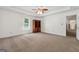 Spacious main bedroom features carpet floors, a trey ceiling with fan, and wooden cabinet at 1120 Rawlings Dr, Rutledge, GA 30663