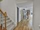 Basement hallway with wood floors leading to a craft room with shelving at 140 Silvermere, Fayetteville, GA 30215