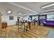 Finished basement area with hardwood floors, neutral walls, bright lighting, and versatile spaces for living and hobbies at 140 Silvermere, Fayetteville, GA 30215