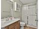 Clean bathroom with a shower, vanity, and a mirrored cabinet, perfect for a functional and well-maintained space at 140 Silvermere, Fayetteville, GA 30215