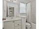 Clean, bright bathroom with a vanity, toilet, and shower-tub combination at 140 Silvermere, Fayetteville, GA 30215