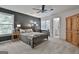 Modern bedroom with neutral carpet and dark accent wall at 140 Silvermere, Fayetteville, GA 30215