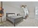 Bright bedroom featuring two beds, a ceiling fan and charming architectural details for added character at 140 Silvermere, Fayetteville, GA 30215