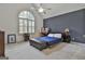 Comfortable bedroom featuring a large arched window and a vaulted ceiling at 140 Silvermere, Fayetteville, GA 30215