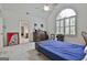 Spacious bedroom with a large arched window, neutral carpet, and furniture at 140 Silvermere, Fayetteville, GA 30215