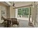 Inviting covered deck with ceiling fan, and a wooded view at 140 Silvermere, Fayetteville, GA 30215