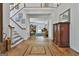 Grand foyer with hardwood floors, staircase, and views into the living spaces at 140 Silvermere, Fayetteville, GA 30215