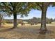 Scenic view of the golf course as seen from the property's land, framed by mature trees at 140 Silvermere, Fayetteville, GA 30215