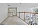 Bright hallway with wood trim railings overlooking the bottom floor at 140 Silvermere, Fayetteville, GA 30215