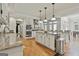 Gourmet kitchen with stainless steel appliances, granite countertops, a kitchen island and double ovens at 140 Silvermere, Fayetteville, GA 30215