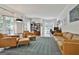 Bright living room featuring large windows, hardwood floors, and ample seating for entertaining at 140 Silvermere, Fayetteville, GA 30215