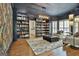Stylish living room with custom built-in bookshelves and hardwood floors at 140 Silvermere, Fayetteville, GA 30215