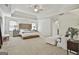 Spacious main bedroom with tray ceiling, carpet flooring, and sitting area at 140 Silvermere, Fayetteville, GA 30215