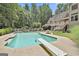 Large in-ground pool with diving board, perfect for summer fun and relaxation at 140 Silvermere, Fayetteville, GA 30215