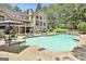 Beautiful backyard with a large in-ground pool, loungers, and a well-maintained lawn at 140 Silvermere, Fayetteville, GA 30215
