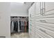 Well-organized walk-in closet with custom built-in shelves and ample storage space at 140 Silvermere, Fayetteville, GA 30215