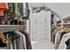 Organized walk-in closet with built-in shelving, drawers, and hanging storage at 140 Silvermere, Fayetteville, GA 30215