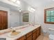 Bathroom featuring a double sink vanity, and a large mirror at 25 Ridgeview Dr, Jonesboro, GA 30236