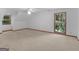 Spacious bedroom with neutral carpet, bright windows, and a ceiling fan at 25 Ridgeview Dr, Jonesboro, GA 30236