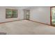 Sunlit bedroom with neutral carpet, and multiple windows offering ample natural light at 25 Ridgeview Dr, Jonesboro, GA 30236