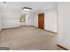 Bedroom with neutral carpet, angled ceilings, and closet at 25 Ridgeview Dr, Jonesboro, GA 30236